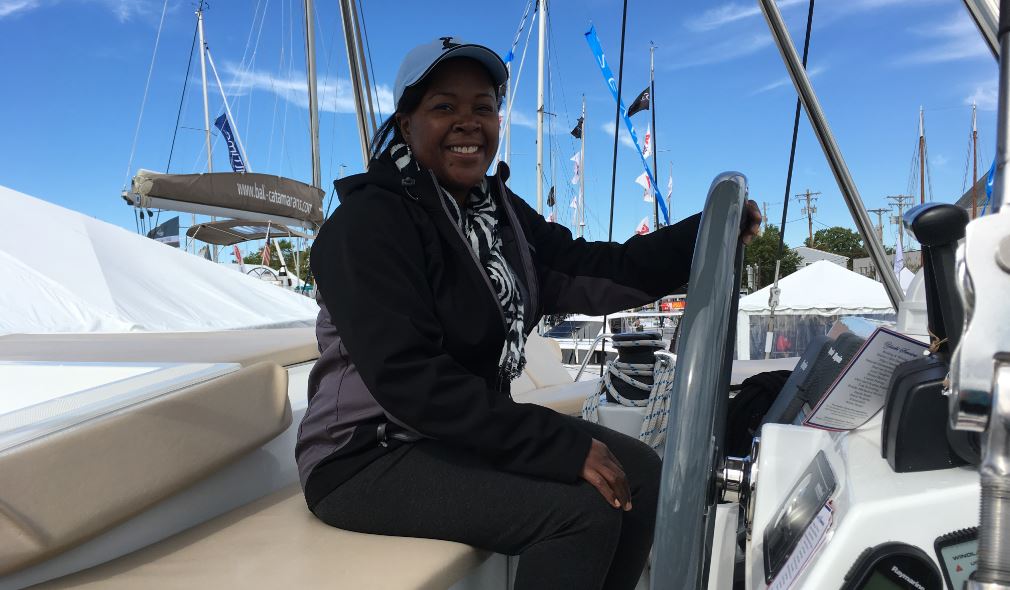 Eldora is pictured smiling radiantly on a boat.
