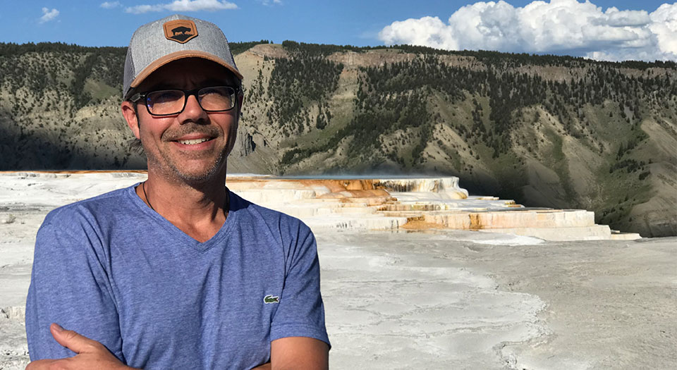 Peter, seen here at the Mammoth Hot Springs in Yellowstone National Park, enjoys getting outdoors and travelling with his family.